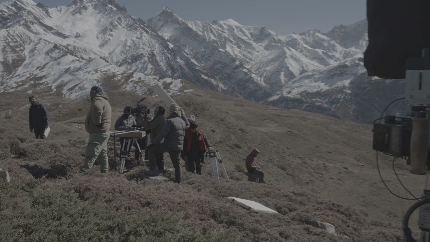 Behind the scenes: camera setup against the snow peaks
